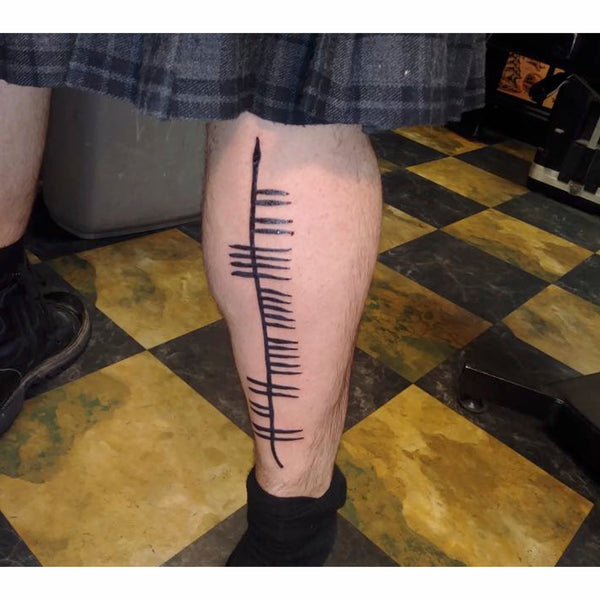 Ogham tattoo leg