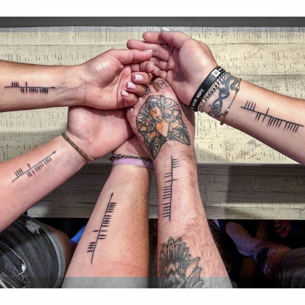 Ogham tattoo arms