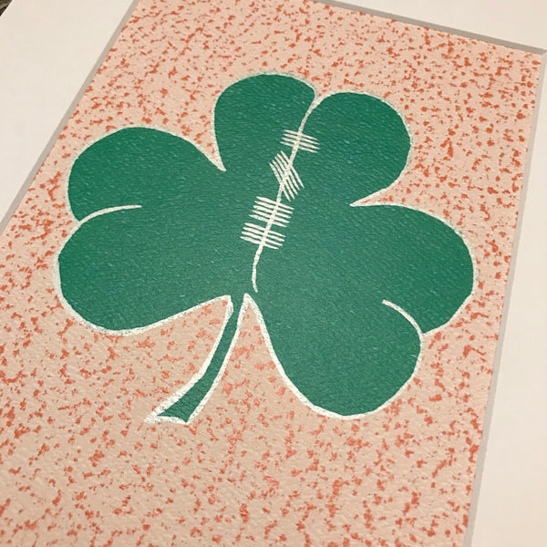 Close Up of painted shamrock with Ogham writing in the center