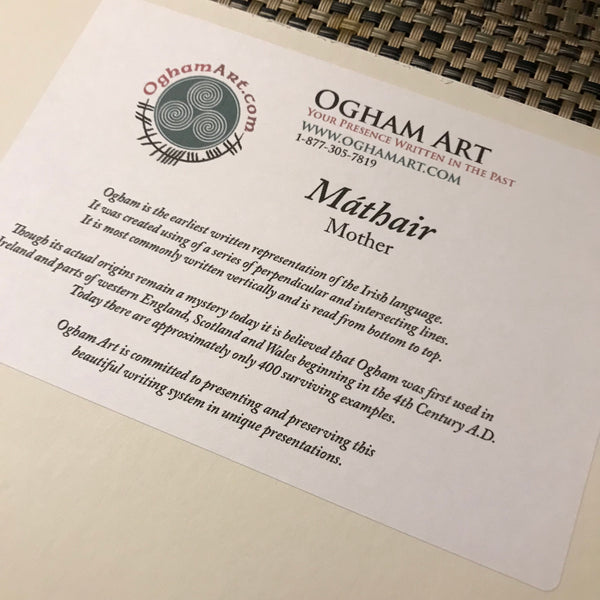 Mother Mathair printed on a white sticker with explanation of Ogham